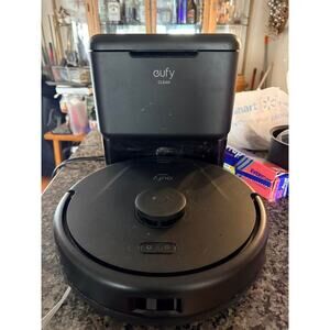 Eufy Clean robot vacuum with a self-empty charging station (model T29B3).